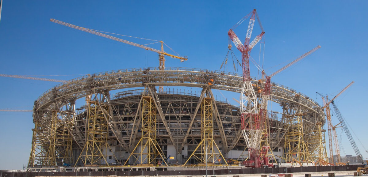 construction-side-of-a-football-stadium-with-cranes-and-scaffoldings